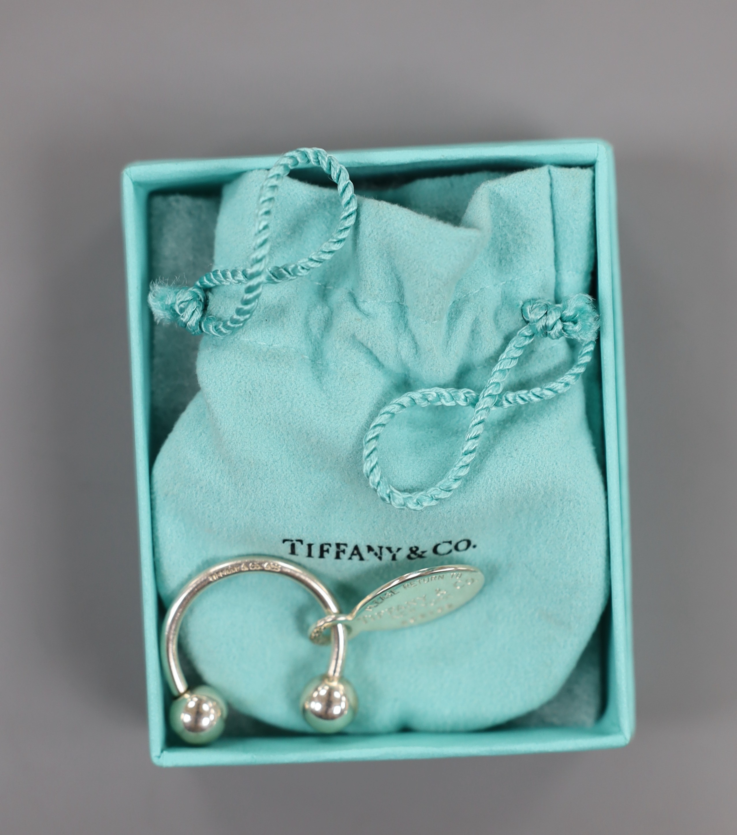 A modern Tiffany & Co sterling 925 keyring, 27mm, with pouch and box.